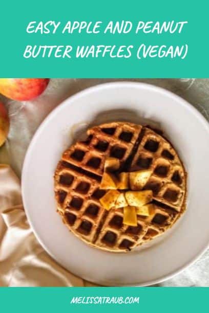 apple and peanut butter waffle on white plate with chopped apples on top