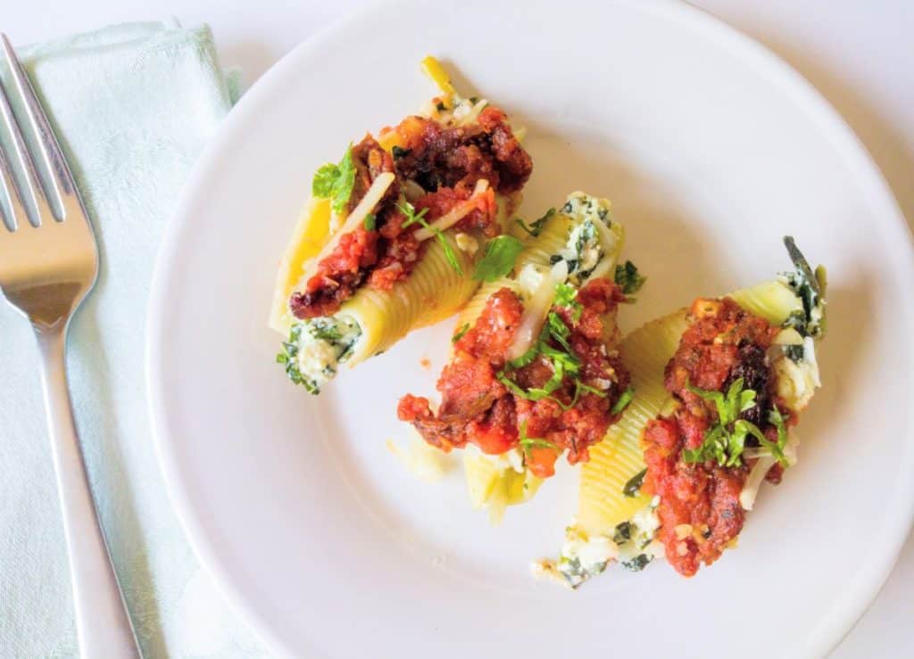 vegan stuffed shells with kale and sun-dried tomatoes