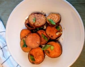 sesame sweet potatoes on white plate