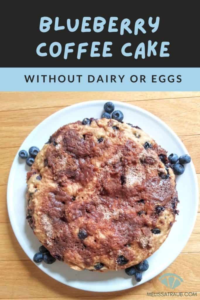 blueberry coffee cake without dairy or eggs on white plate with blueberries