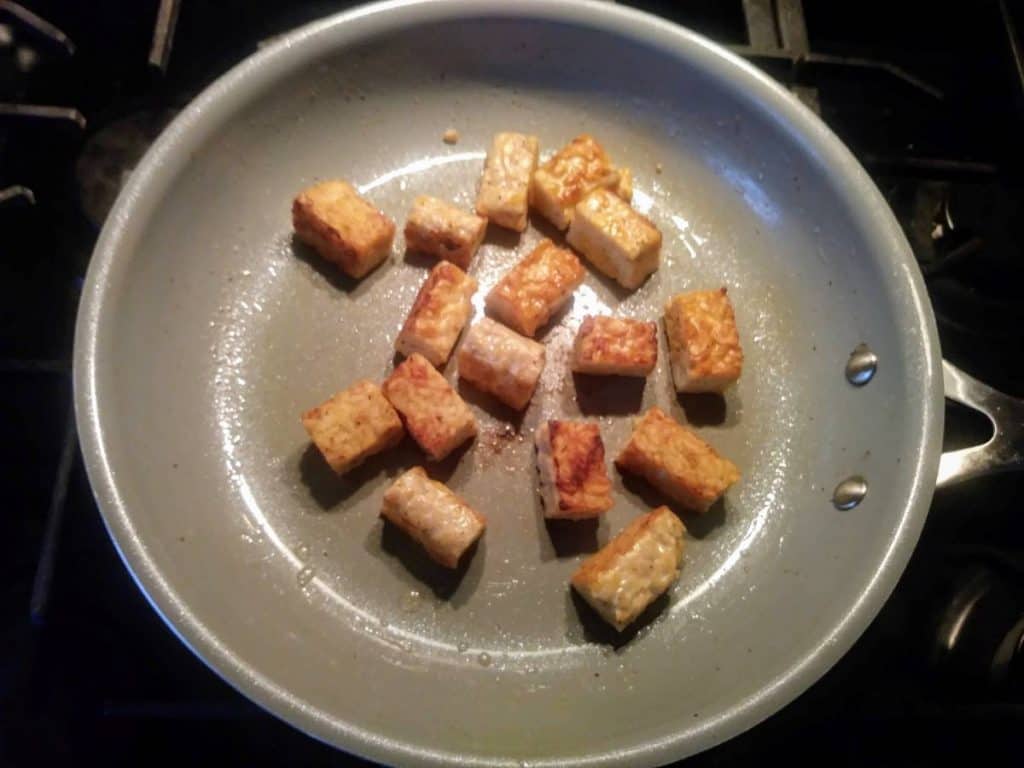 tempeh rectangles in frying pan