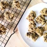 homemade vegan oatmeal date cookies on baking rack and white plate