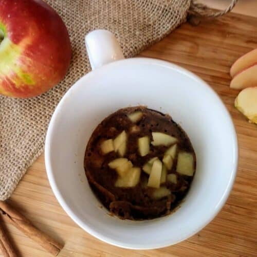 Honeycrisp apple mug cake with apple and cinnamon sticks
