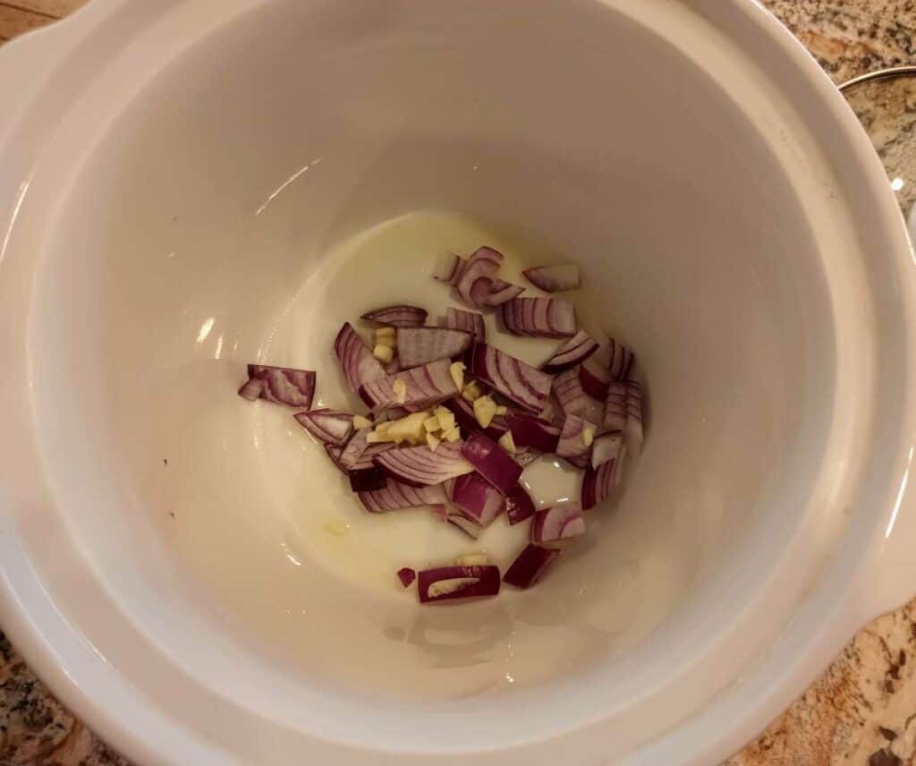 olive oil, red onion, and chopped garlic in slow cooker