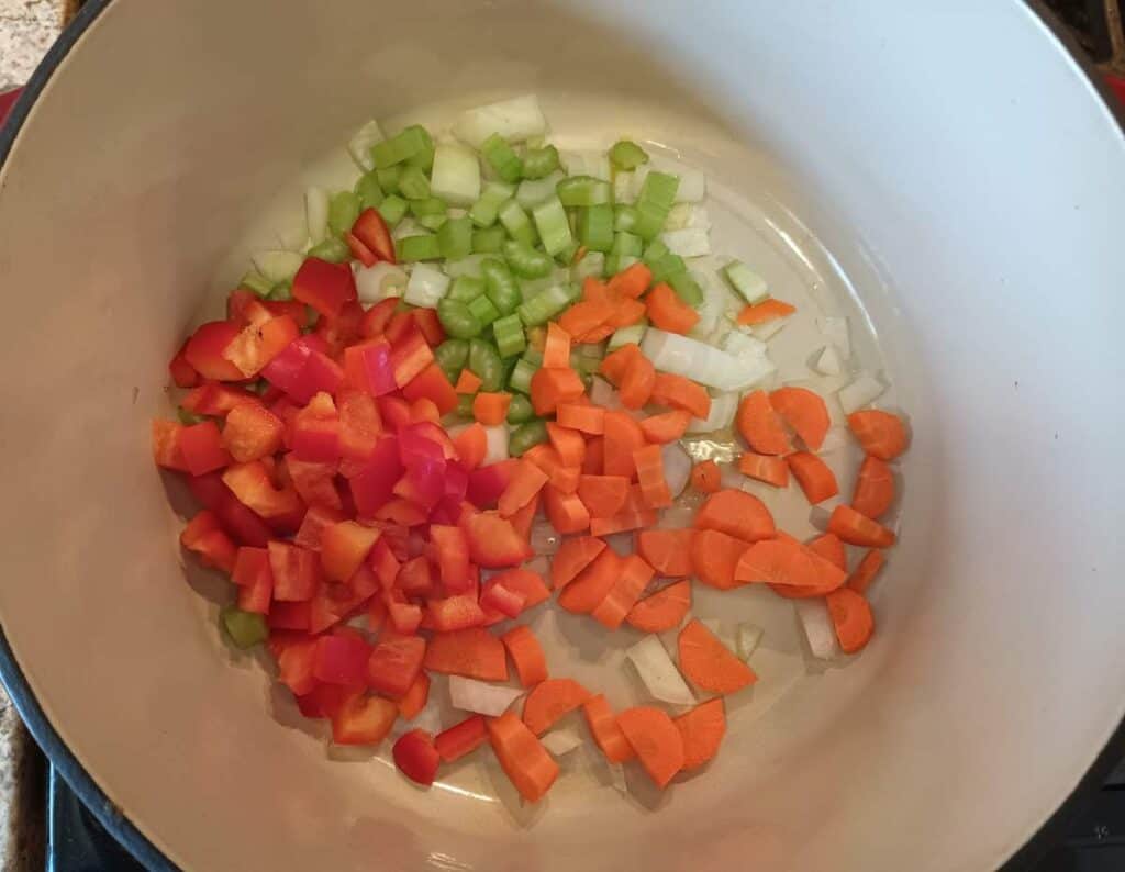sauteing onions, peppers, carrots, and celery.