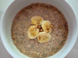 banana overnight oats with slices od banana and walnuts on top.