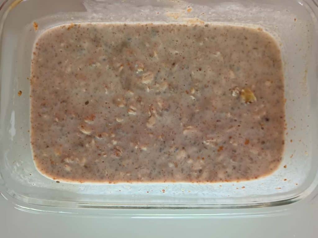 banana overnight oats in glass container.
